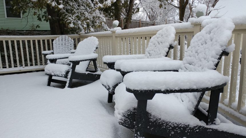 Deck furniture with snow on May 9, 2020.