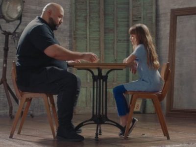 girl playing game with bearded man